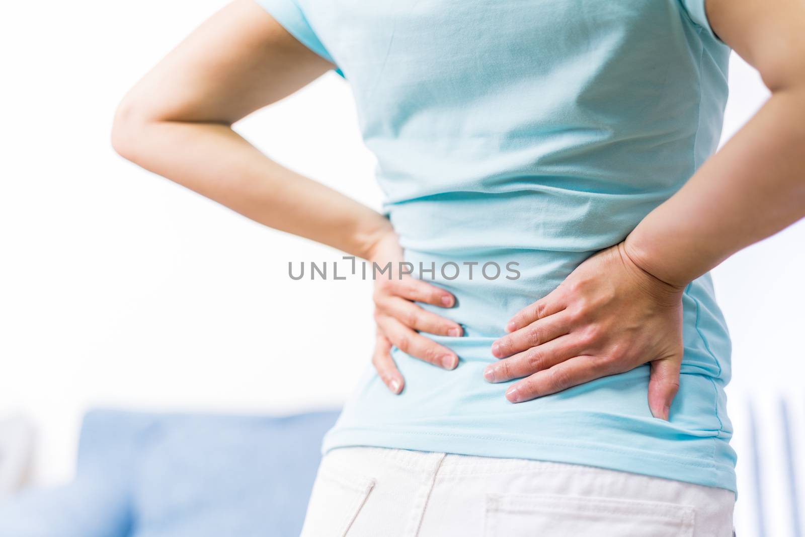 back pain at home. women suffer from backache. healthcare and medical concept