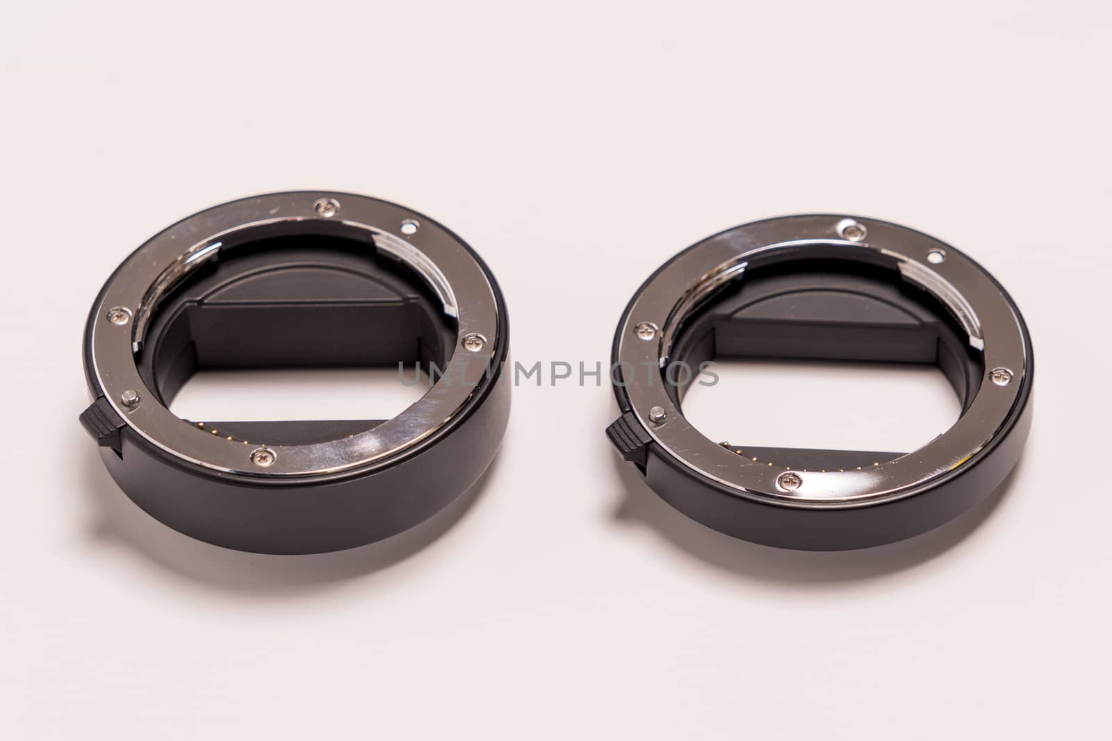double ring macro extension tube on white background