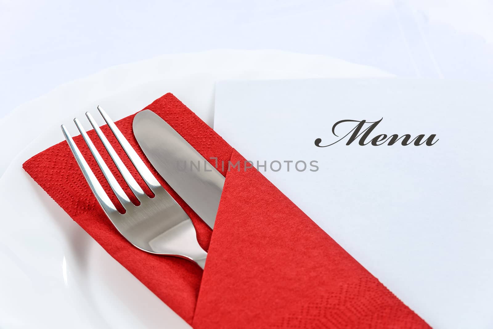 Elegant table setting and a menu in a restaurant