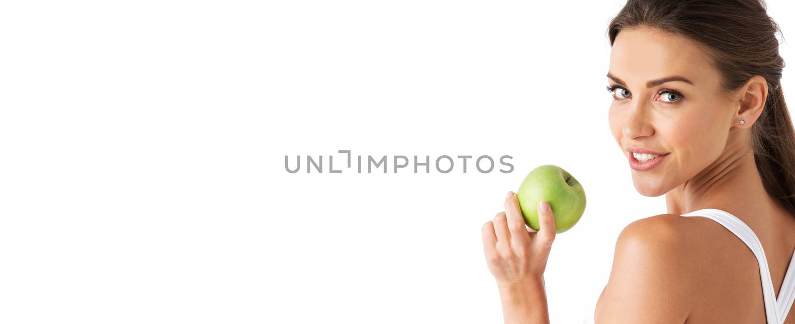 Sexy blonde woman in underwear with apple isolated over white background copy space for text