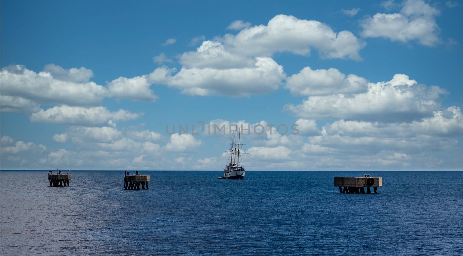 Luxury Sailboat Moored by Conrete Platforms by dbvirago