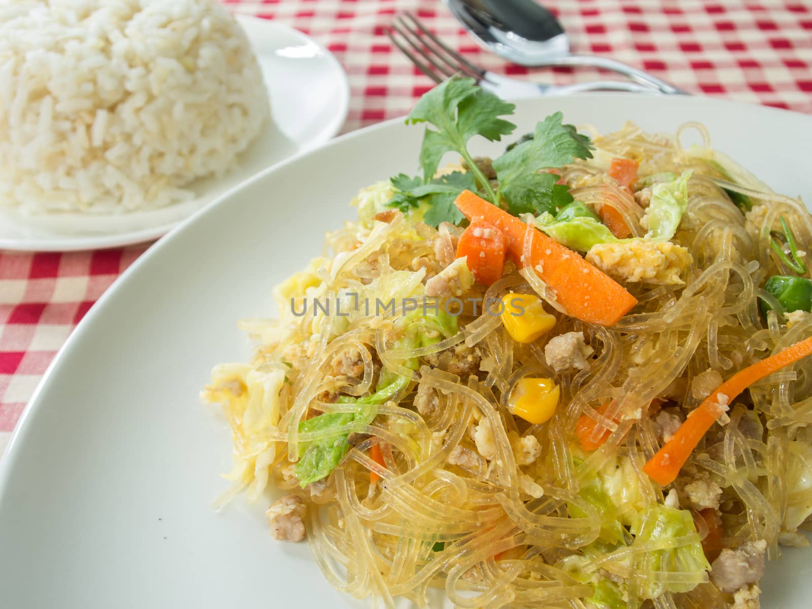fried vermicelli and Cooked rice On the dining table