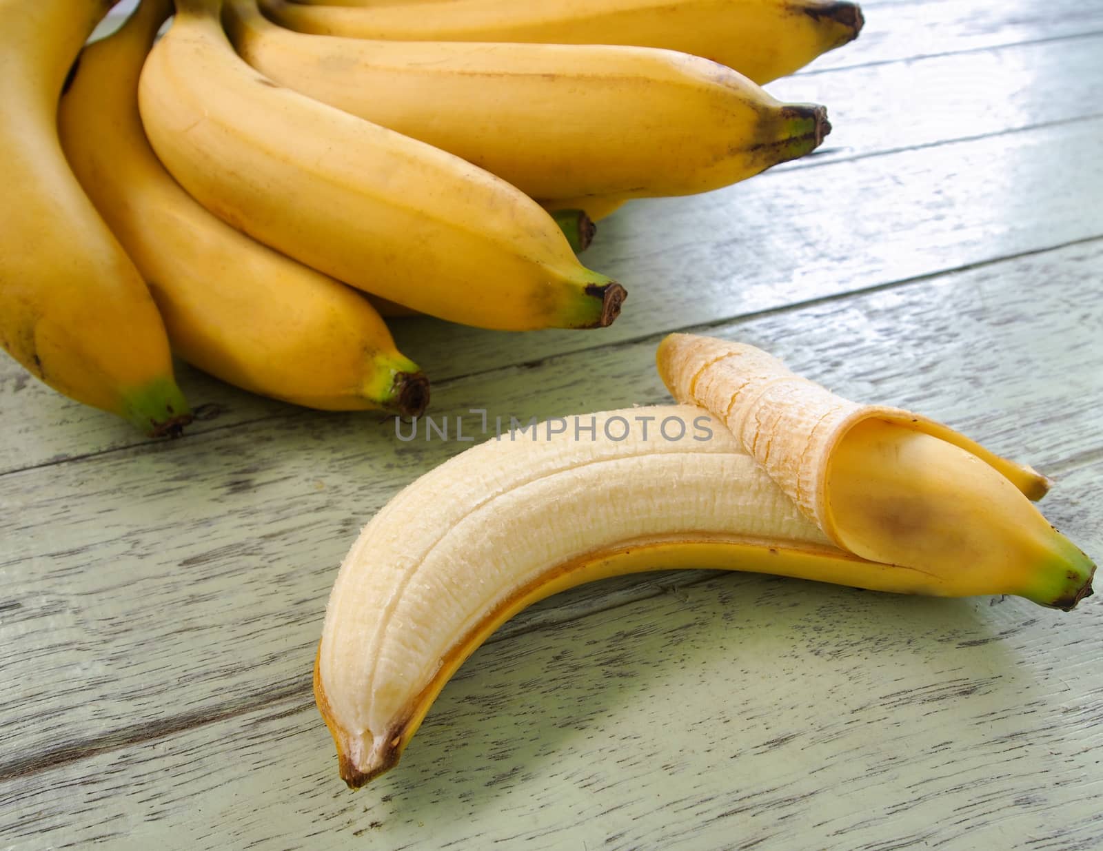 Banana  placed on a wooden table.