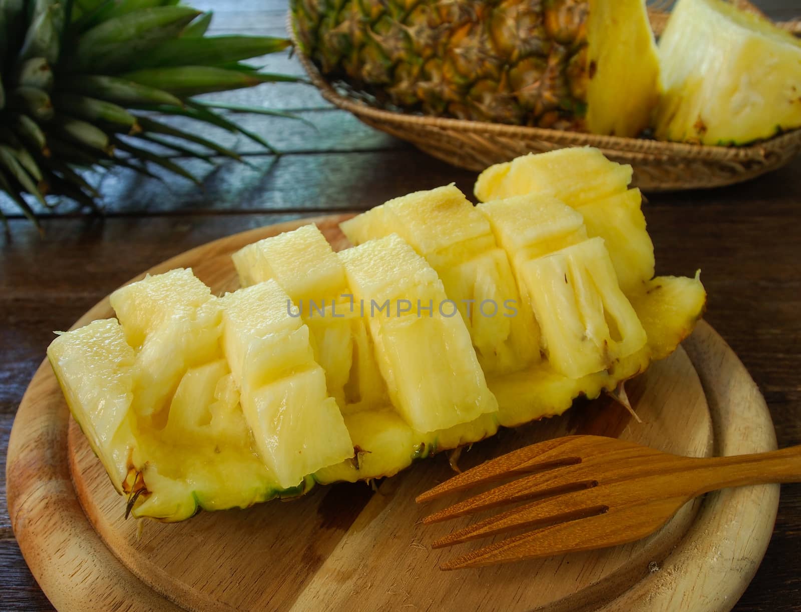 pineapple slices prepared, served on wooden plates.