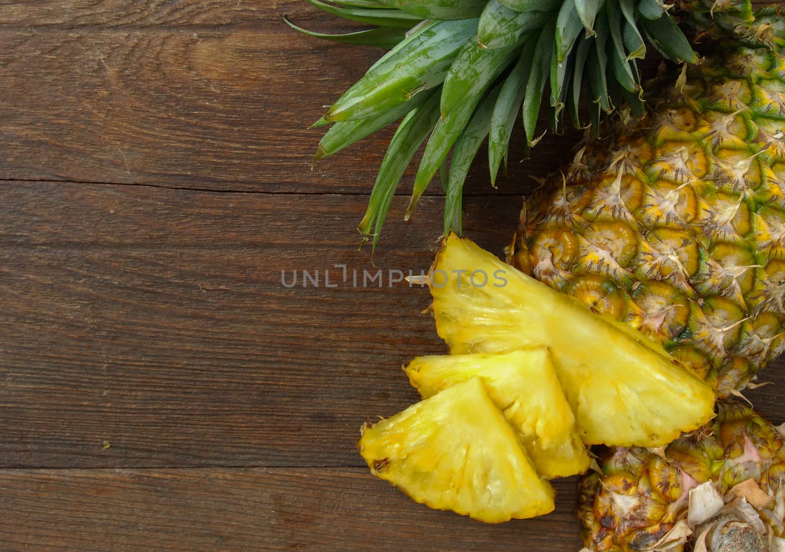 Pineapple on wooden background