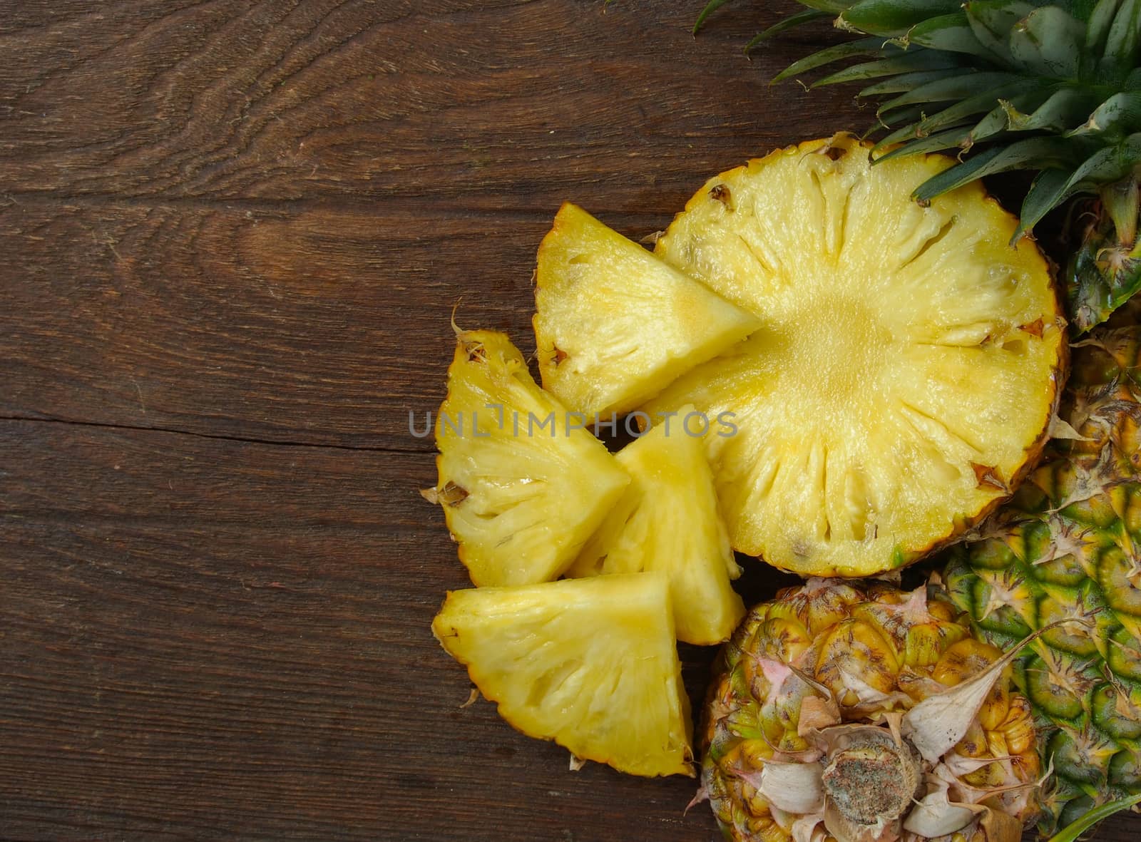 Pineapple on wooden background