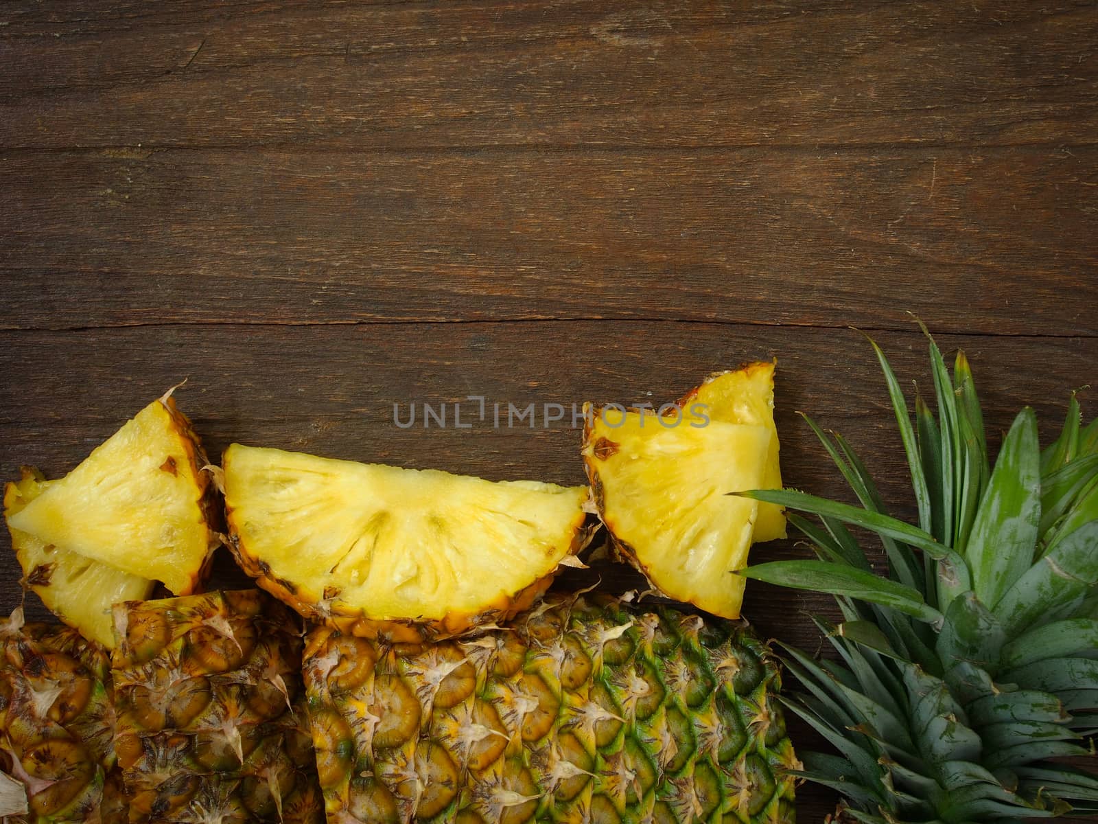 Pineapple on wooden background