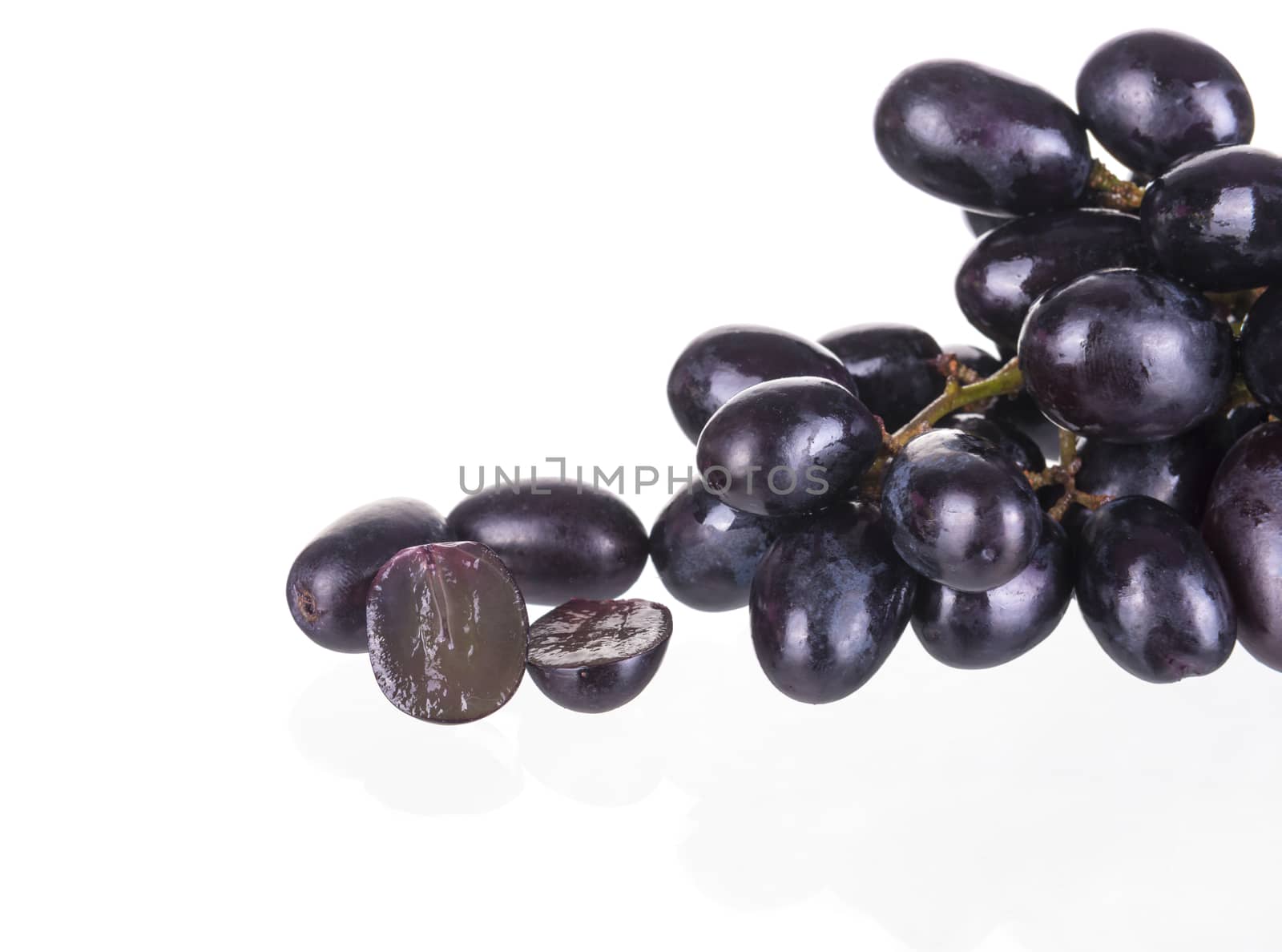 Fresh seedless grapes isolated on white background.