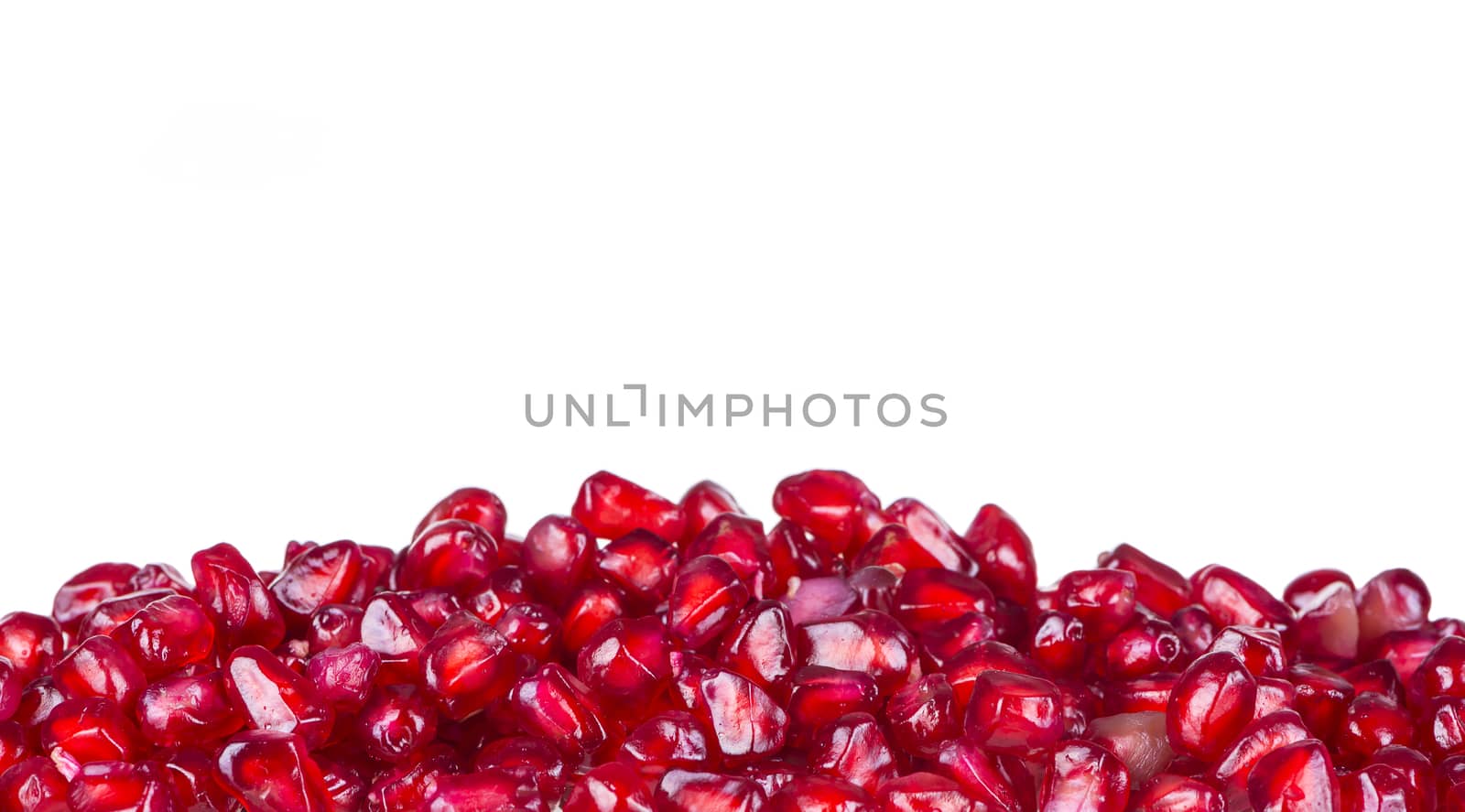 Red pomegranate fruits isolated on white background.