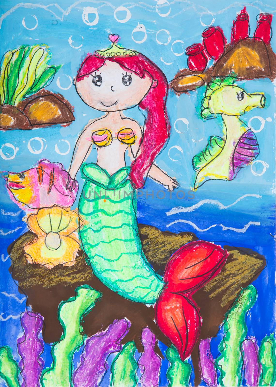 Child drawing using crayon and watercolor