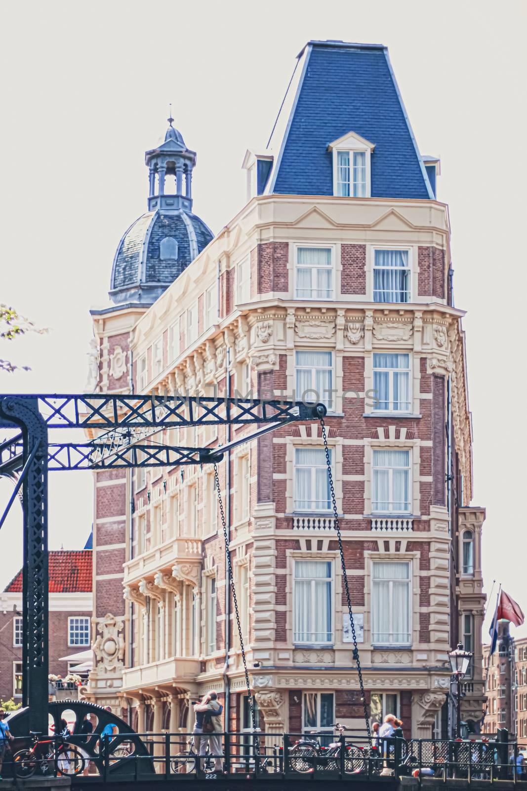 Main downtown street in the city center of Amsterdam in Netherlands on sunny day