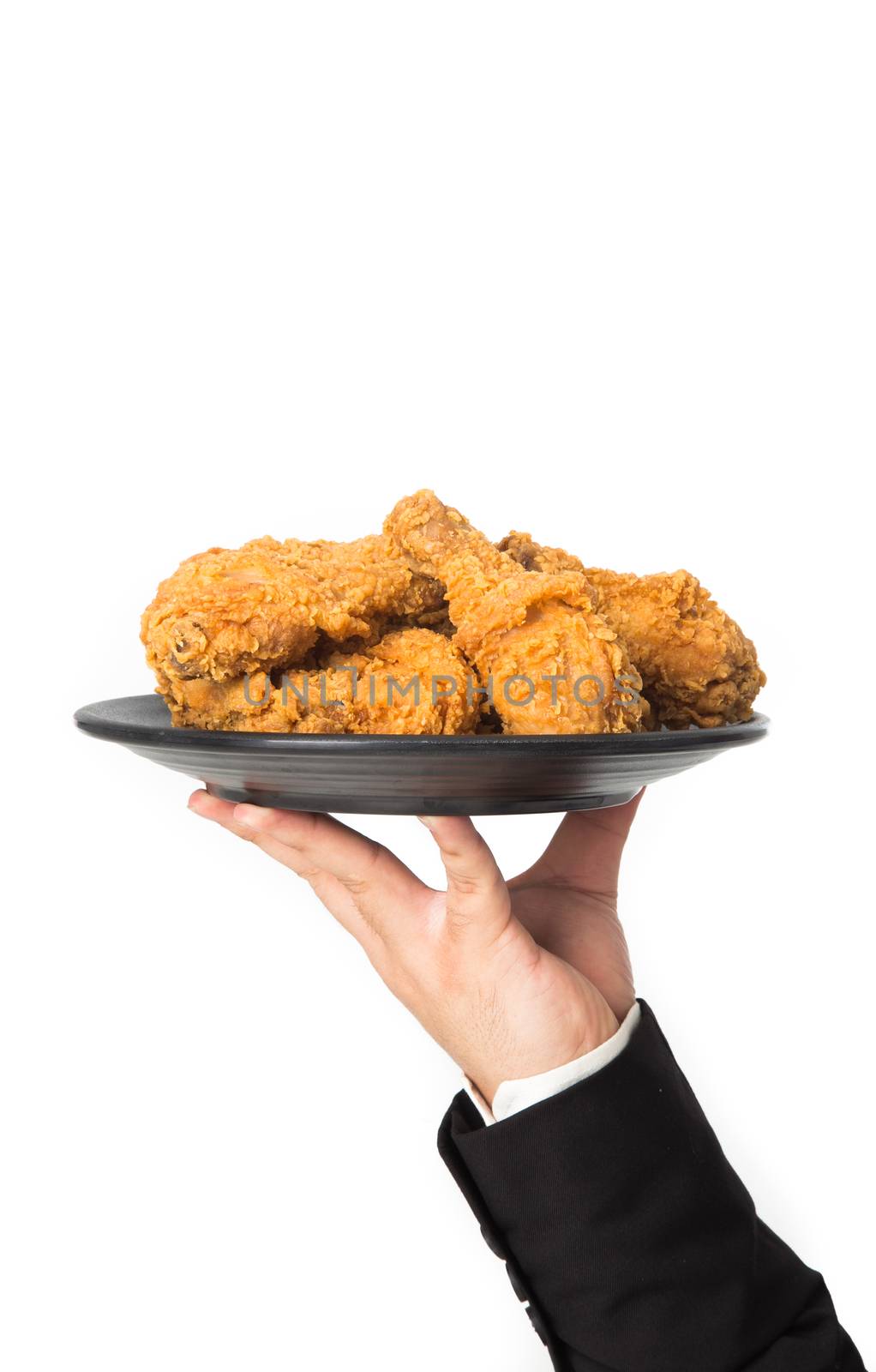 hand holding a plate of fried chicken isolated on white background