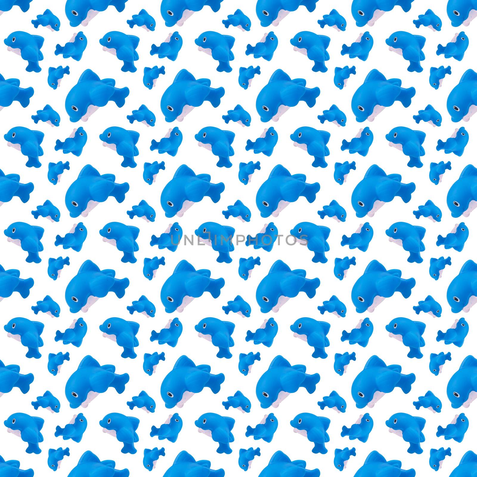 seamless pattern of rubber toy blue whale on white
