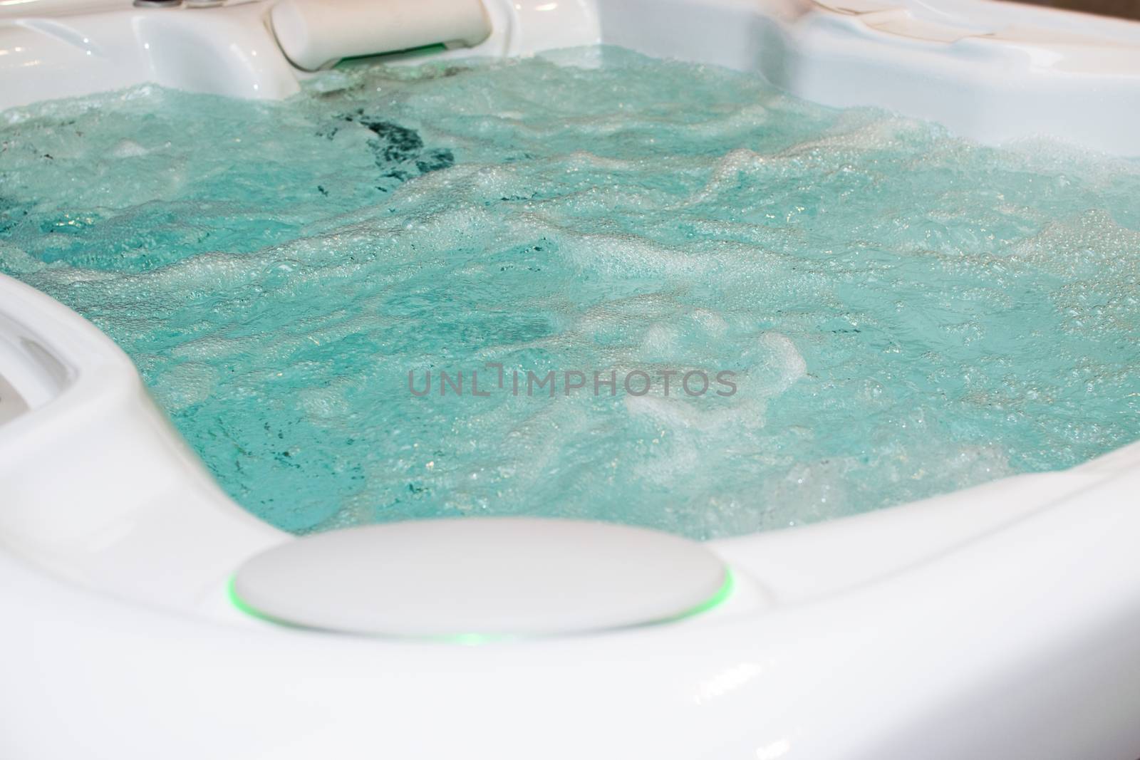 Modern bubbling jacuzzi in a spa or in a luxury hotel, apartment.