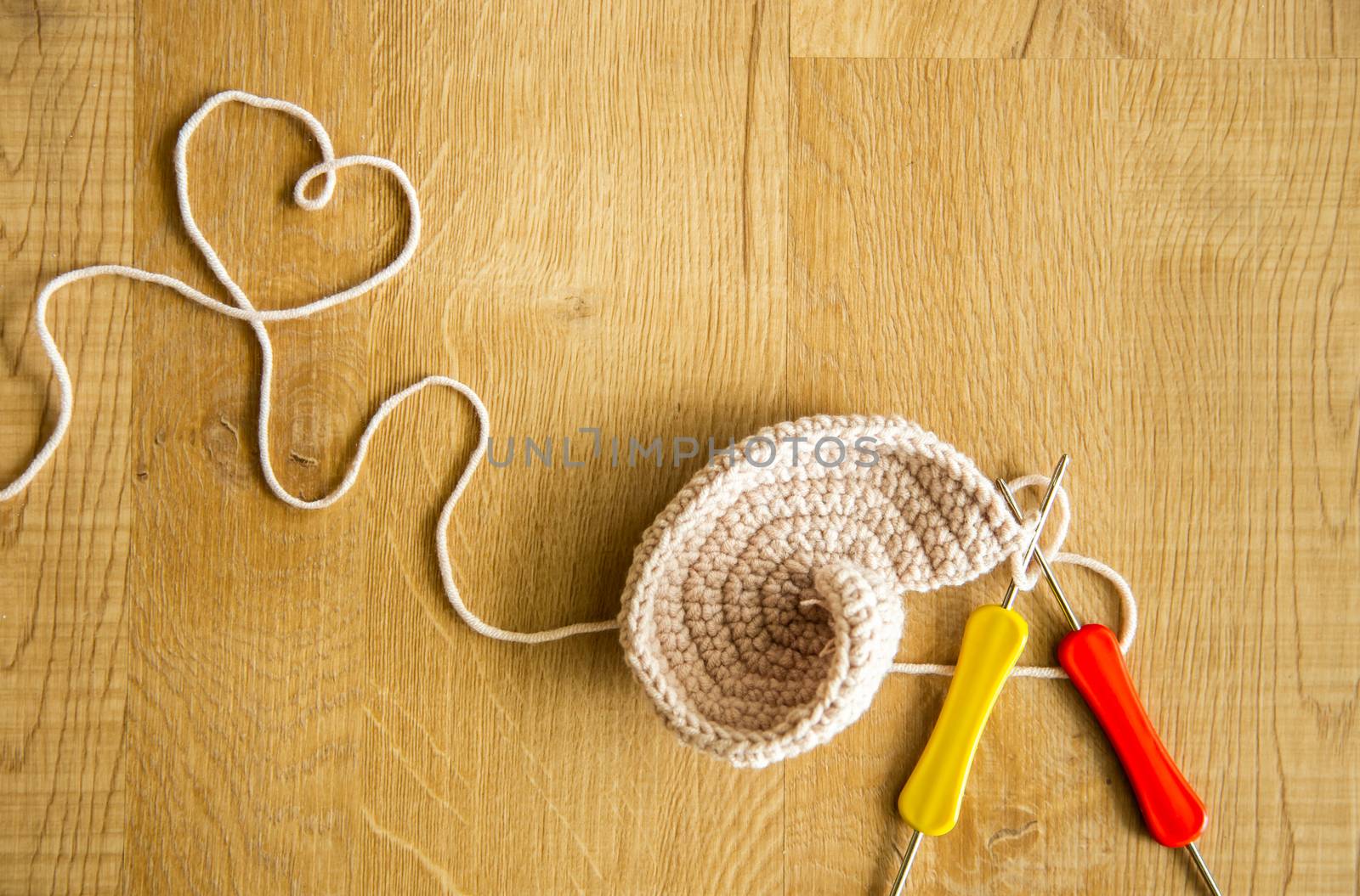 Incomplete knitting project with hook needles