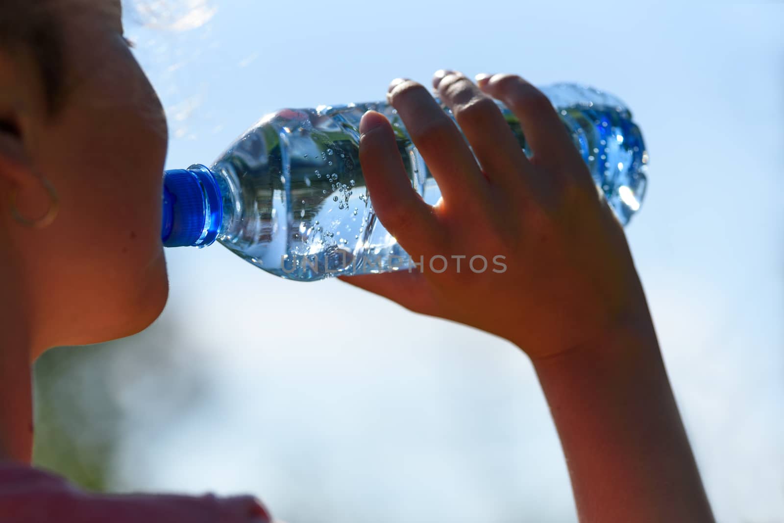 Young woman drinking water by wdnet_studio