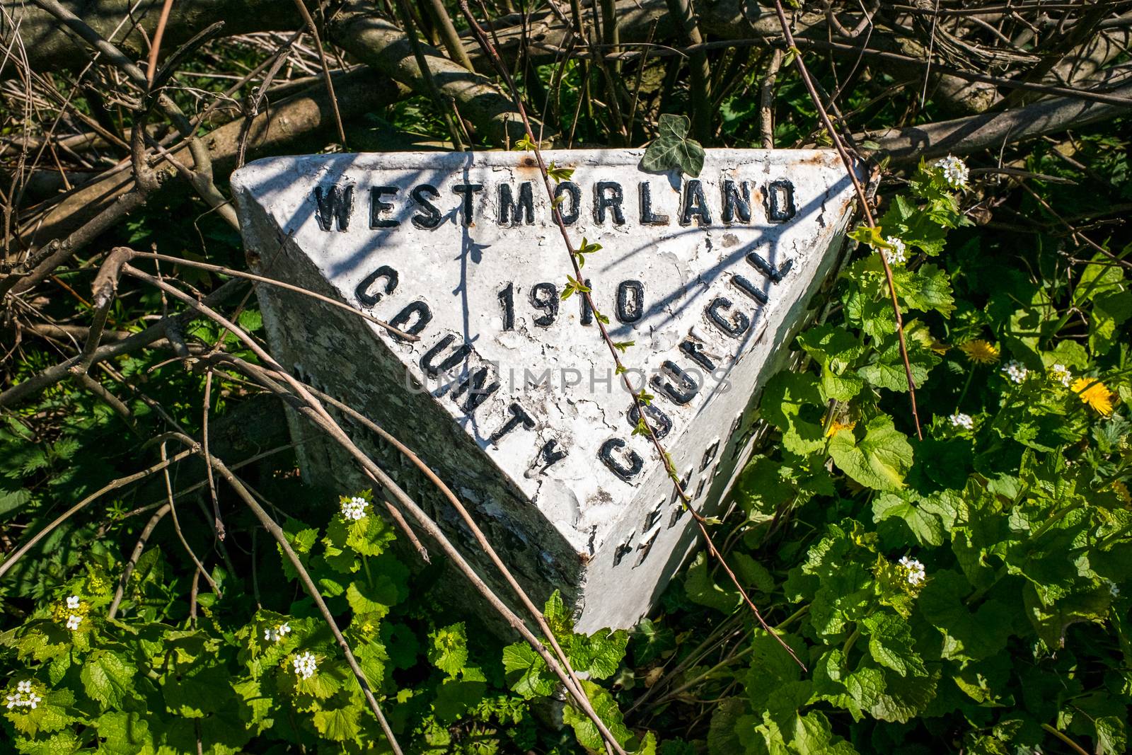 White Milestone indicating Westmorland County Council UK by paddythegolfer