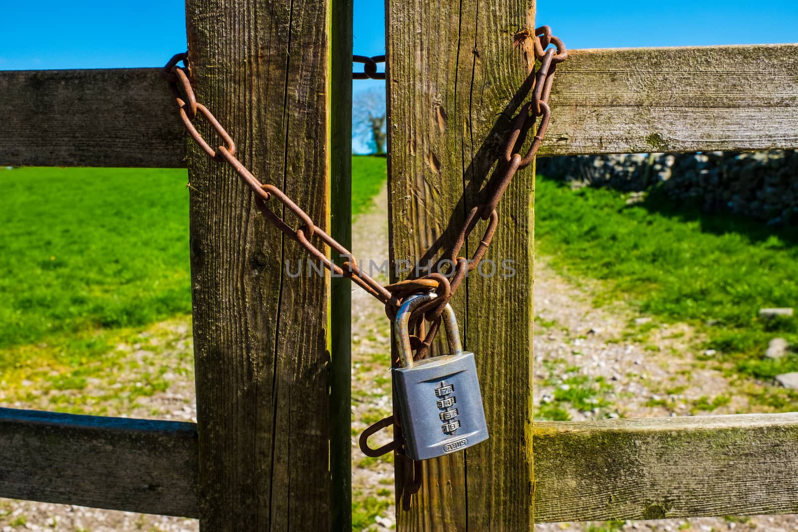 a padlock on a wooden farm gate UK