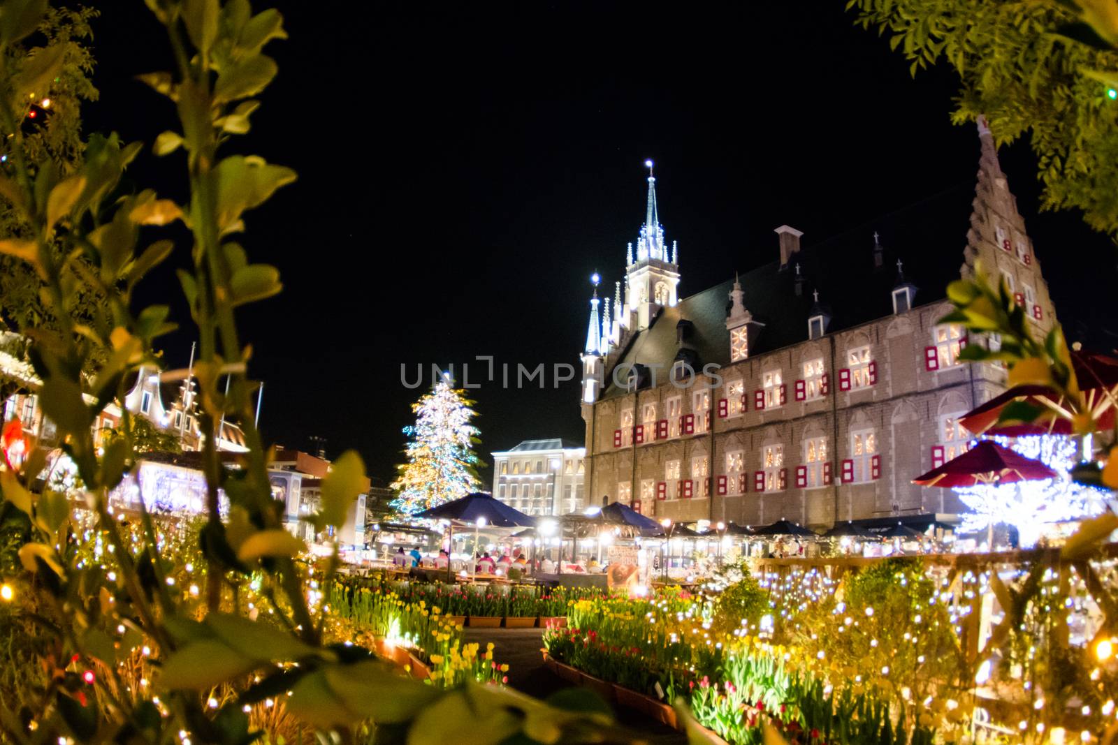 NAGASAKI, JAPAN - April 29, 2019 : Huis Ten Bosch is a theme park in Nagasaki, Japan, which displays old Dutch buildings and colorful lights show at night.