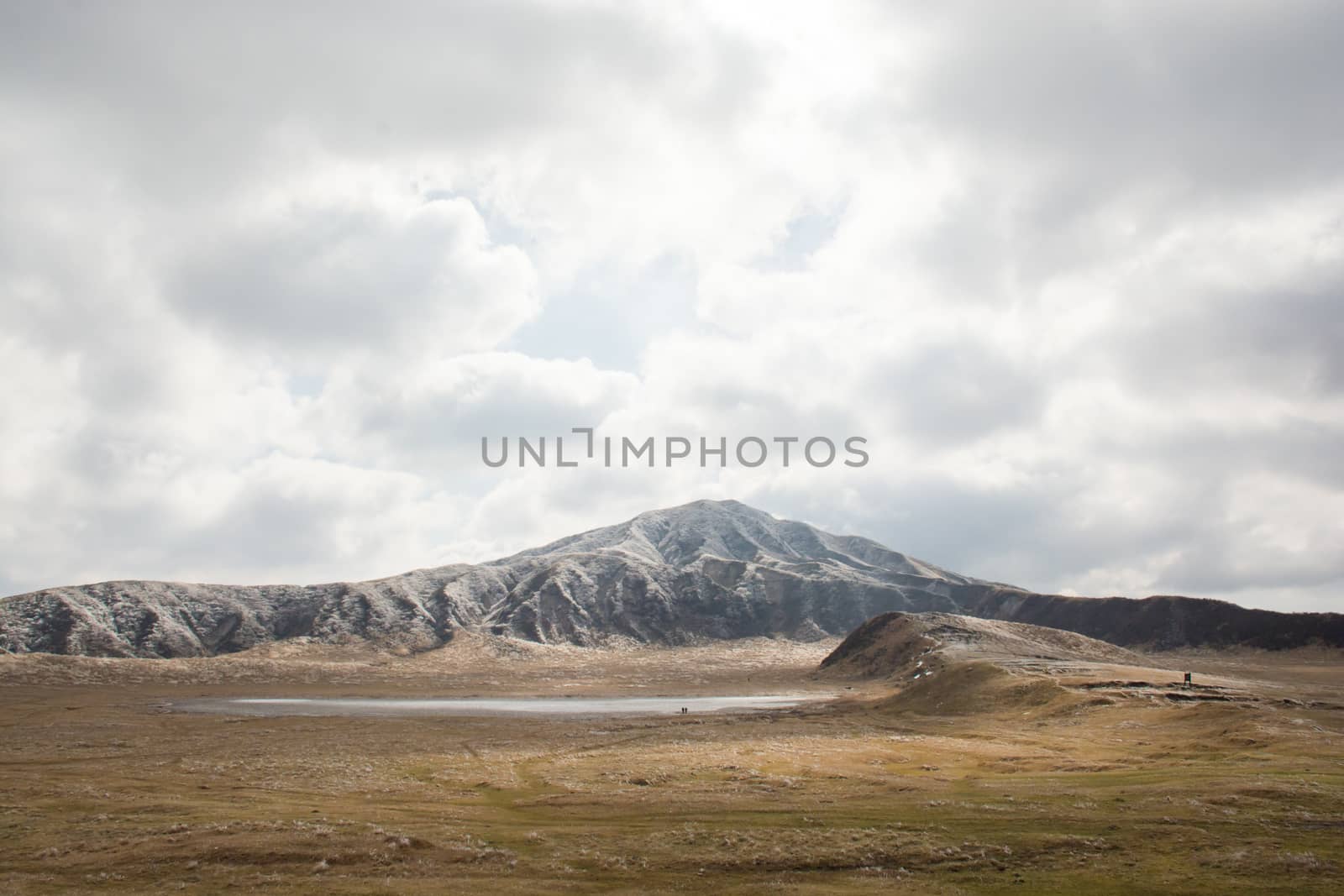 Mount Aso and Kusasenri in winter. covered by golden yellow grassland - Kumamoto, Japan