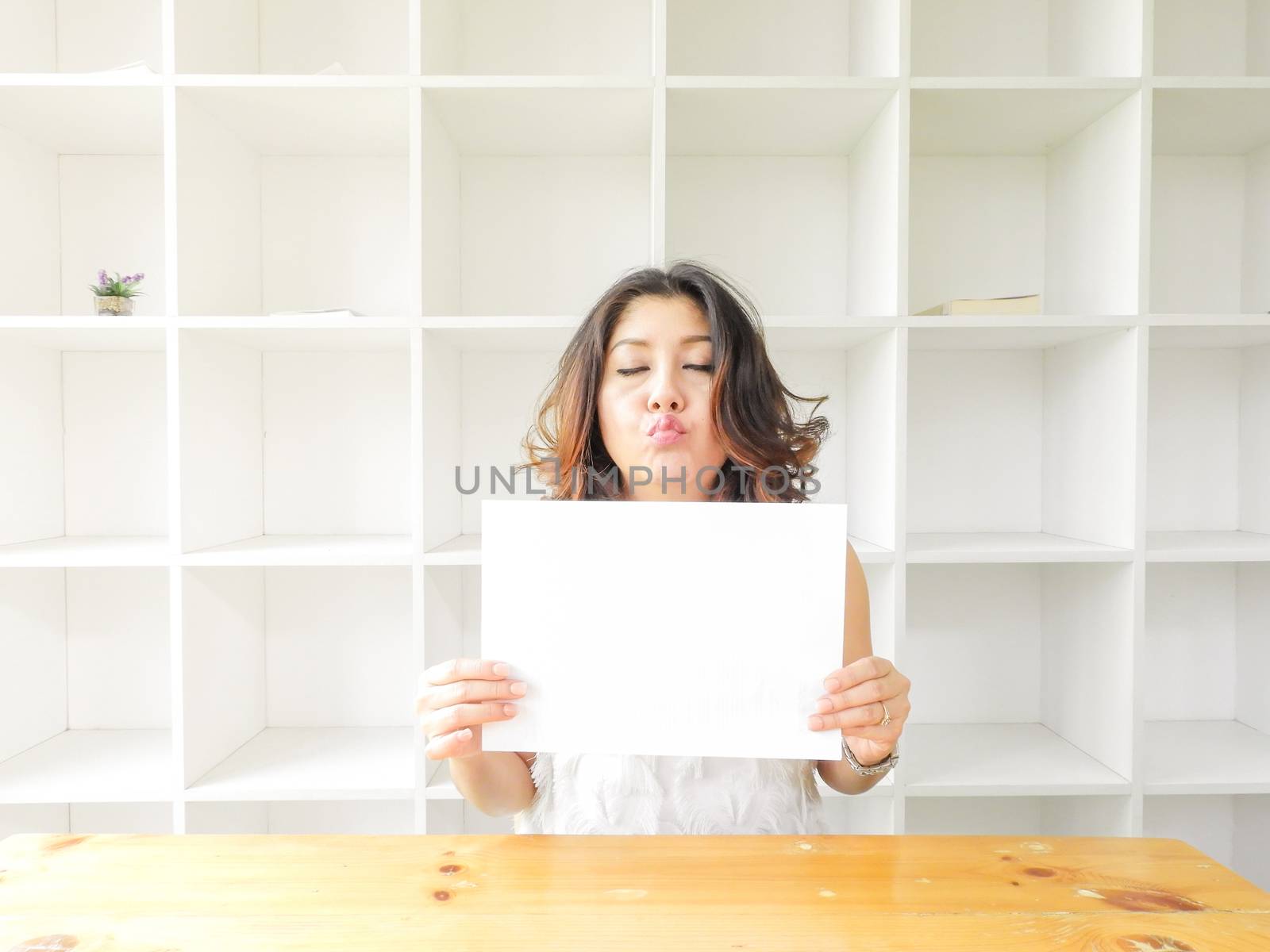 Beautiful woman smiling happy against white background.
