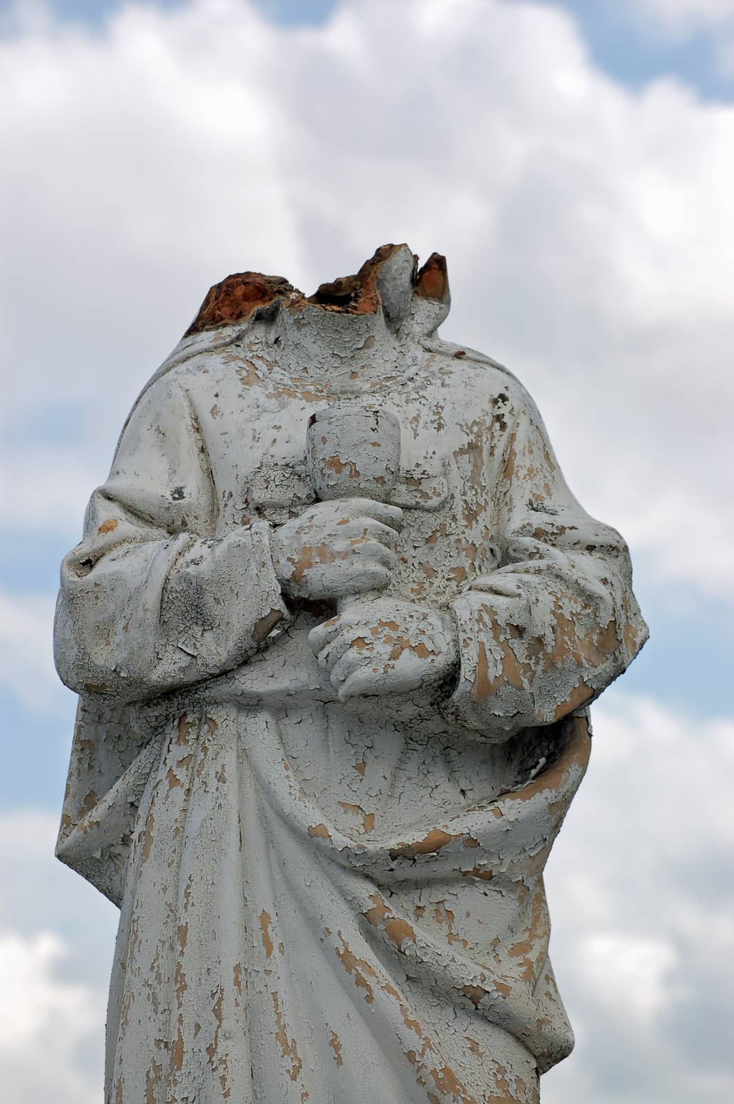 Decapitated angel statue, graveyard, Cuba.