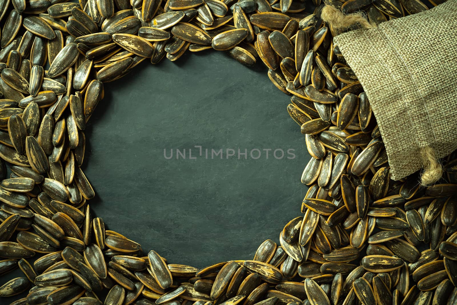 Sun flower seeds in small burlap bag. by SaitanSainam