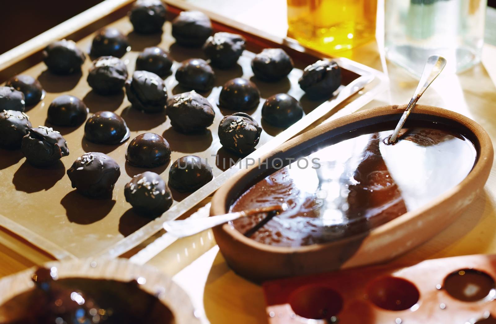 Homemade organic vegetarian chocolates on a table by Novic