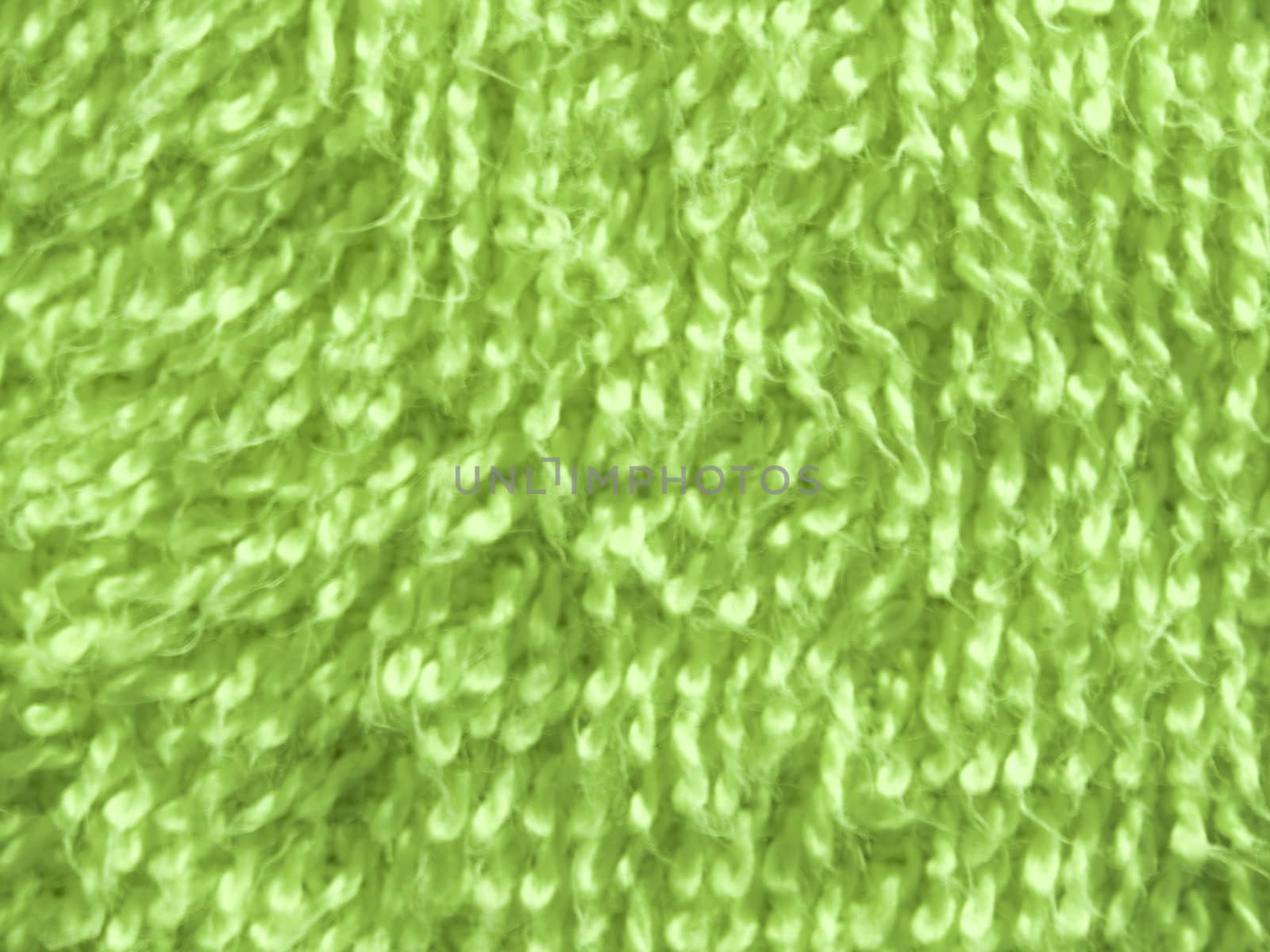 Texture surface close-up of green bath towel