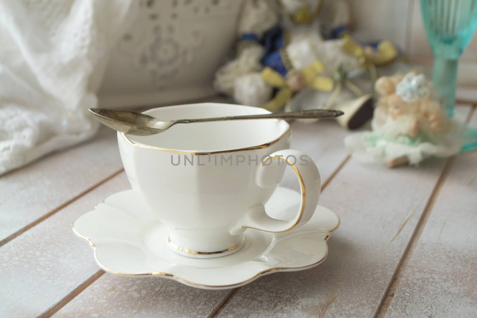 Closeup of white cup of tea on vintage wooden table