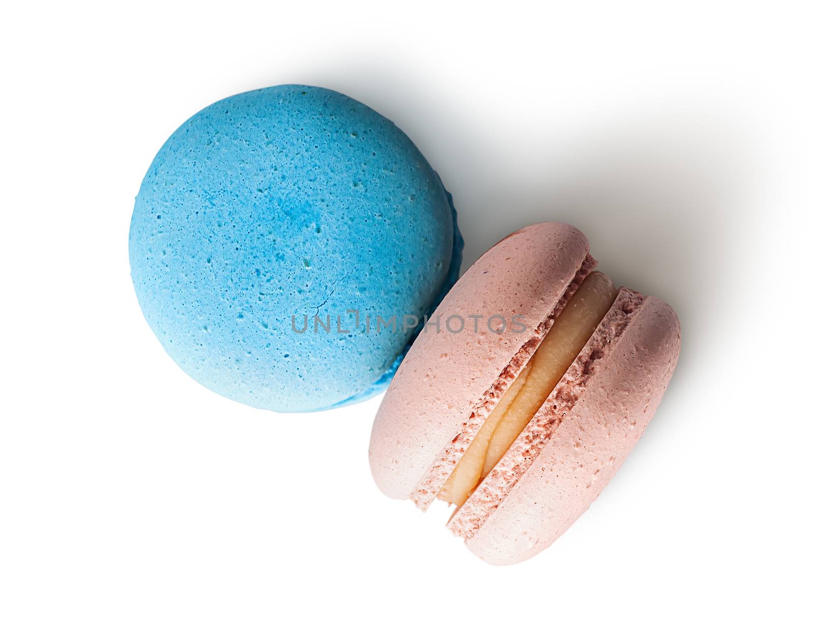 Two macaroon blue beige top view on white background