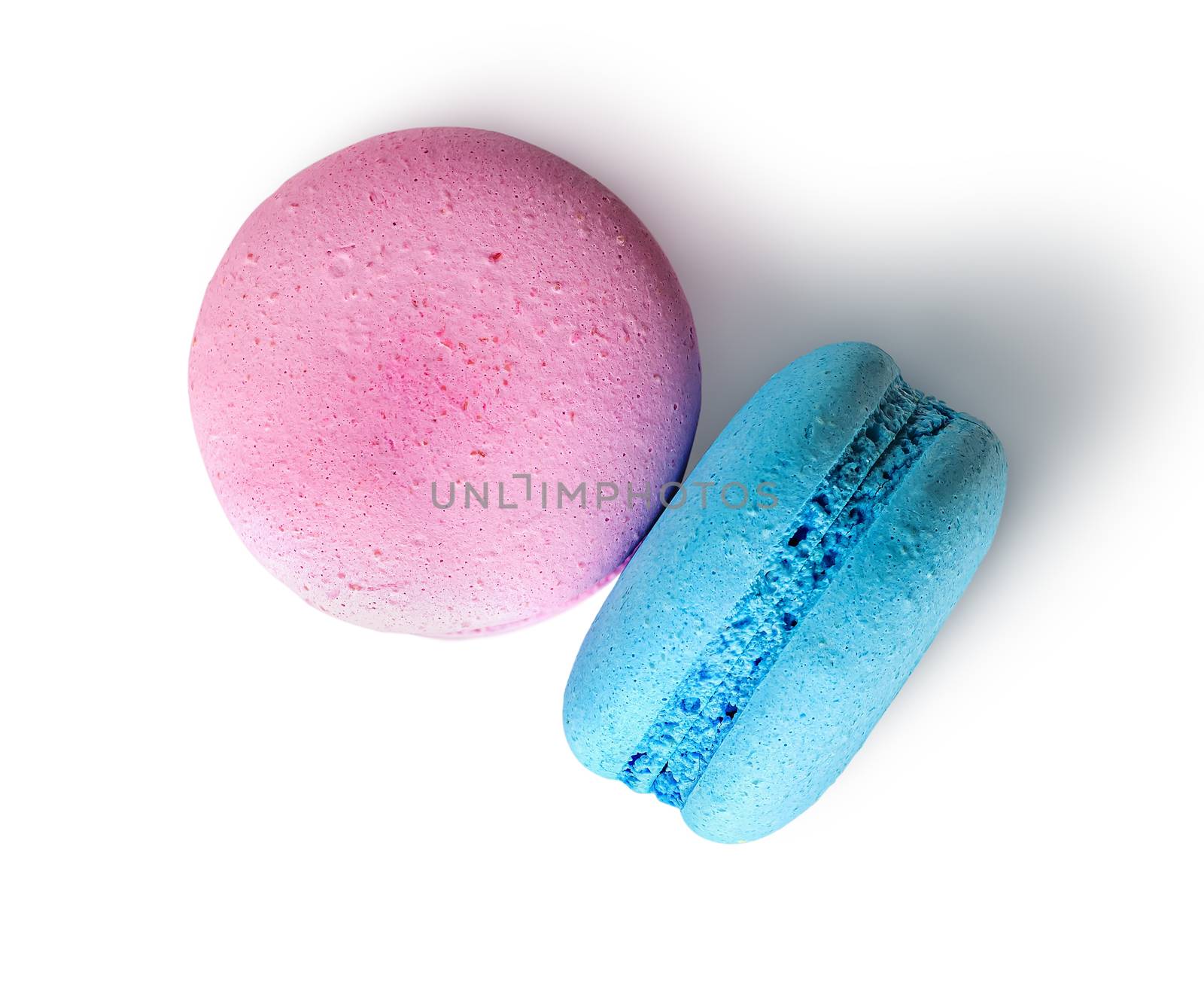 Two macaroon pink blue top view on white background