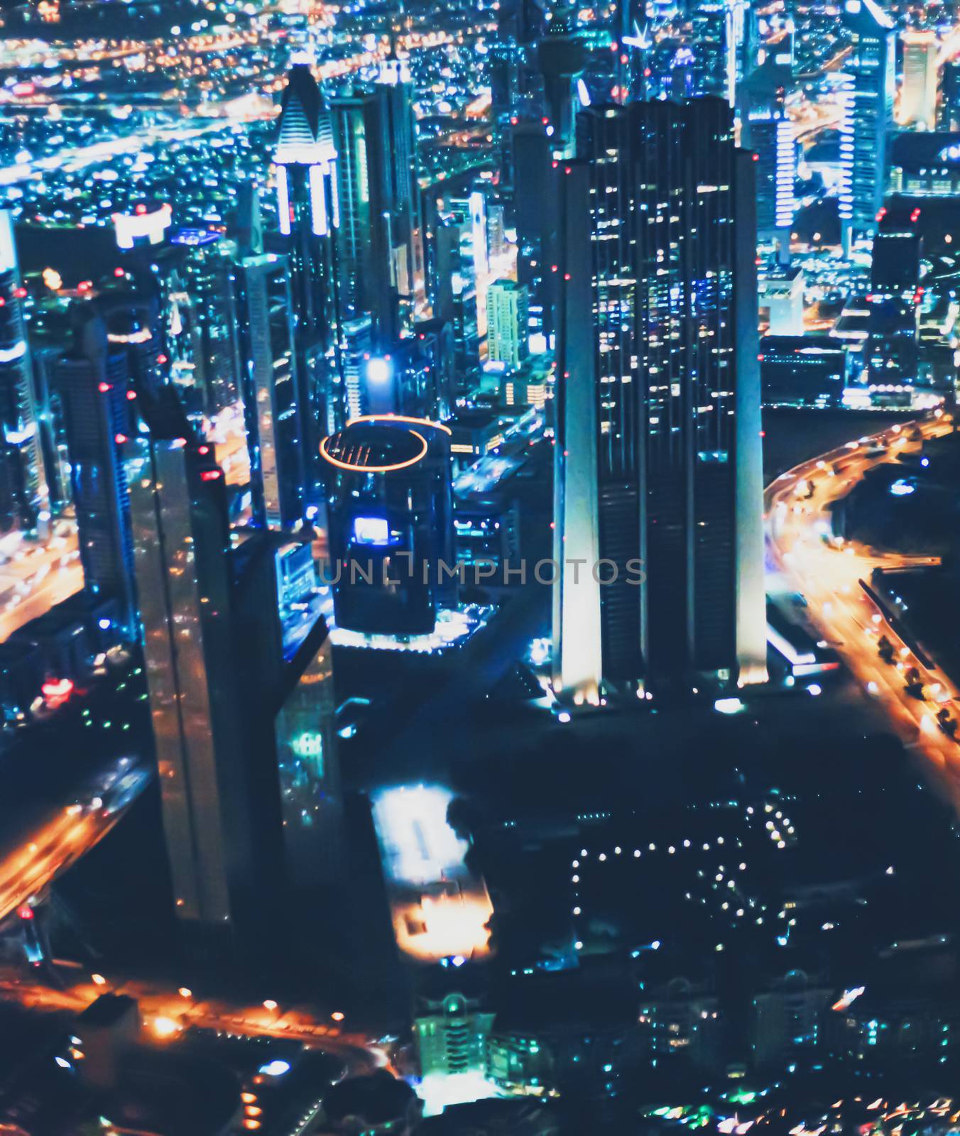 Aerial night view of Dubai in United Arab Emirates, metropolitan cityscape scenery