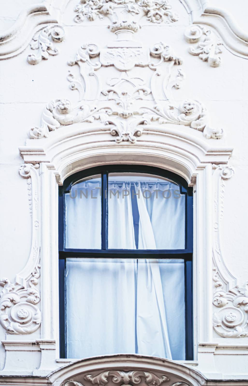 Architectural detail of a building on the main city center street of Amsterdam in Netherlands, european architecture