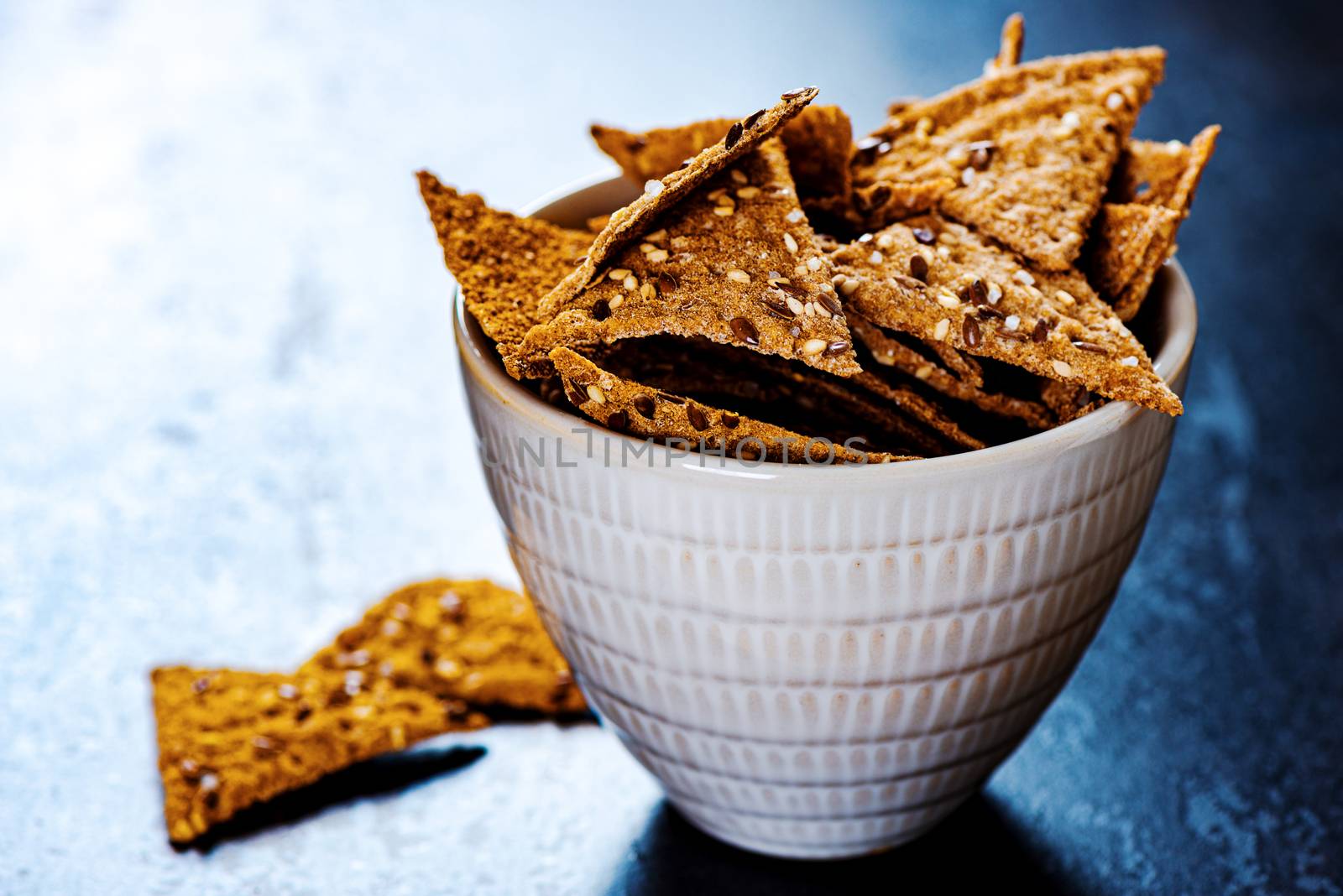 Sesame triangular crispy chips in bowl