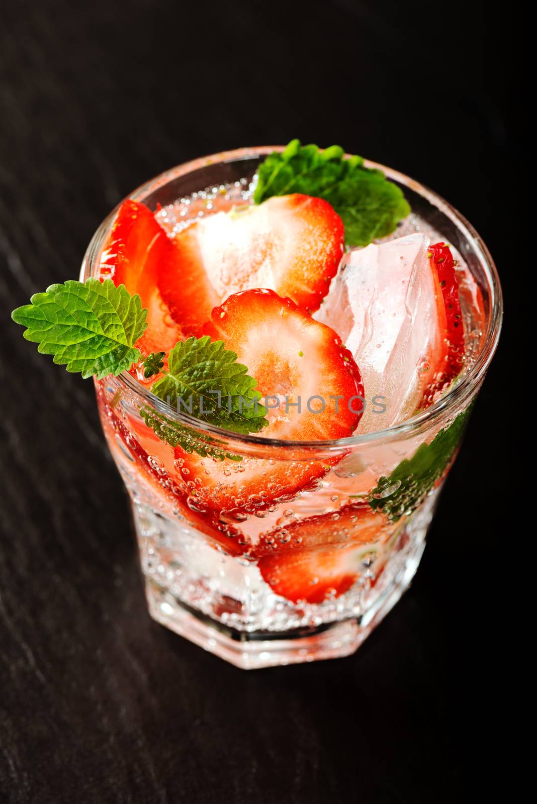 Fresh strawberry drink on dark background