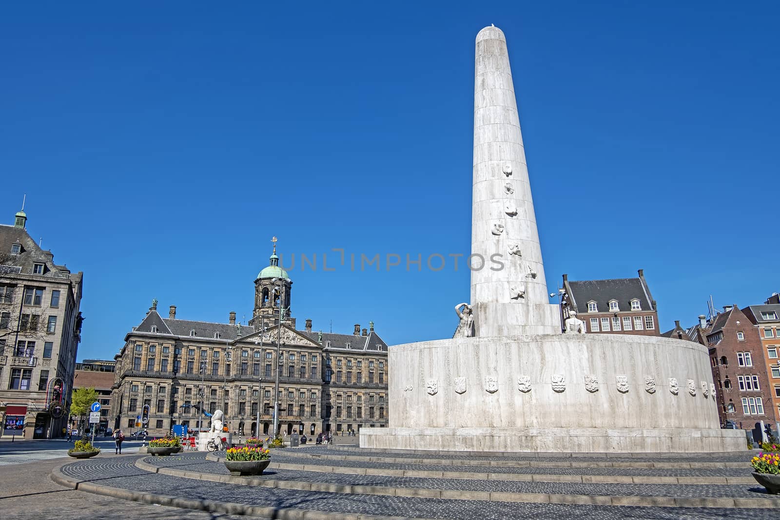 The Dam Square in Amsterdam Netherlands with the National Monument and the Royal Palace