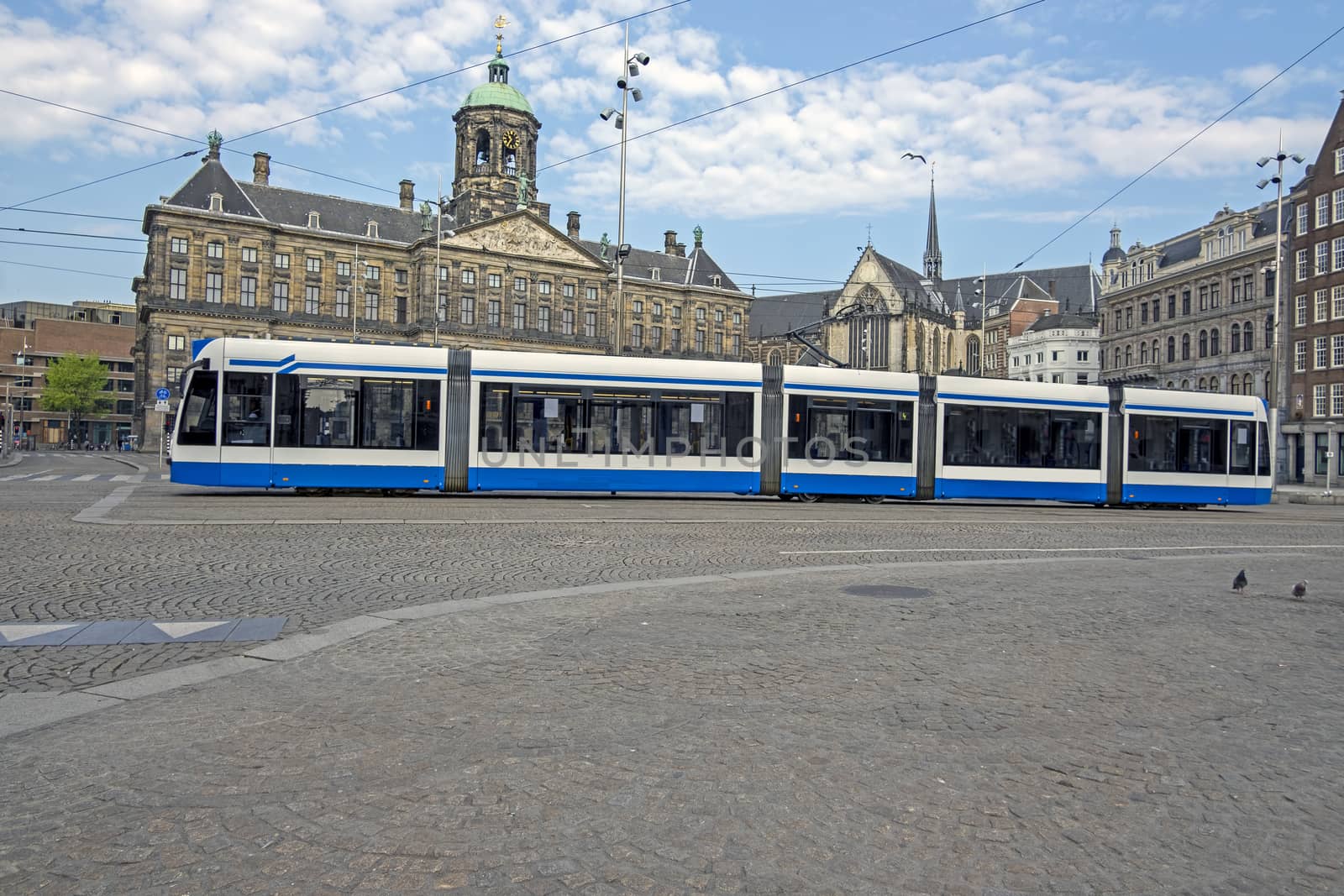 City scenic from Amsterdam at the Dam Square with the Royal Palace in the Netherlands