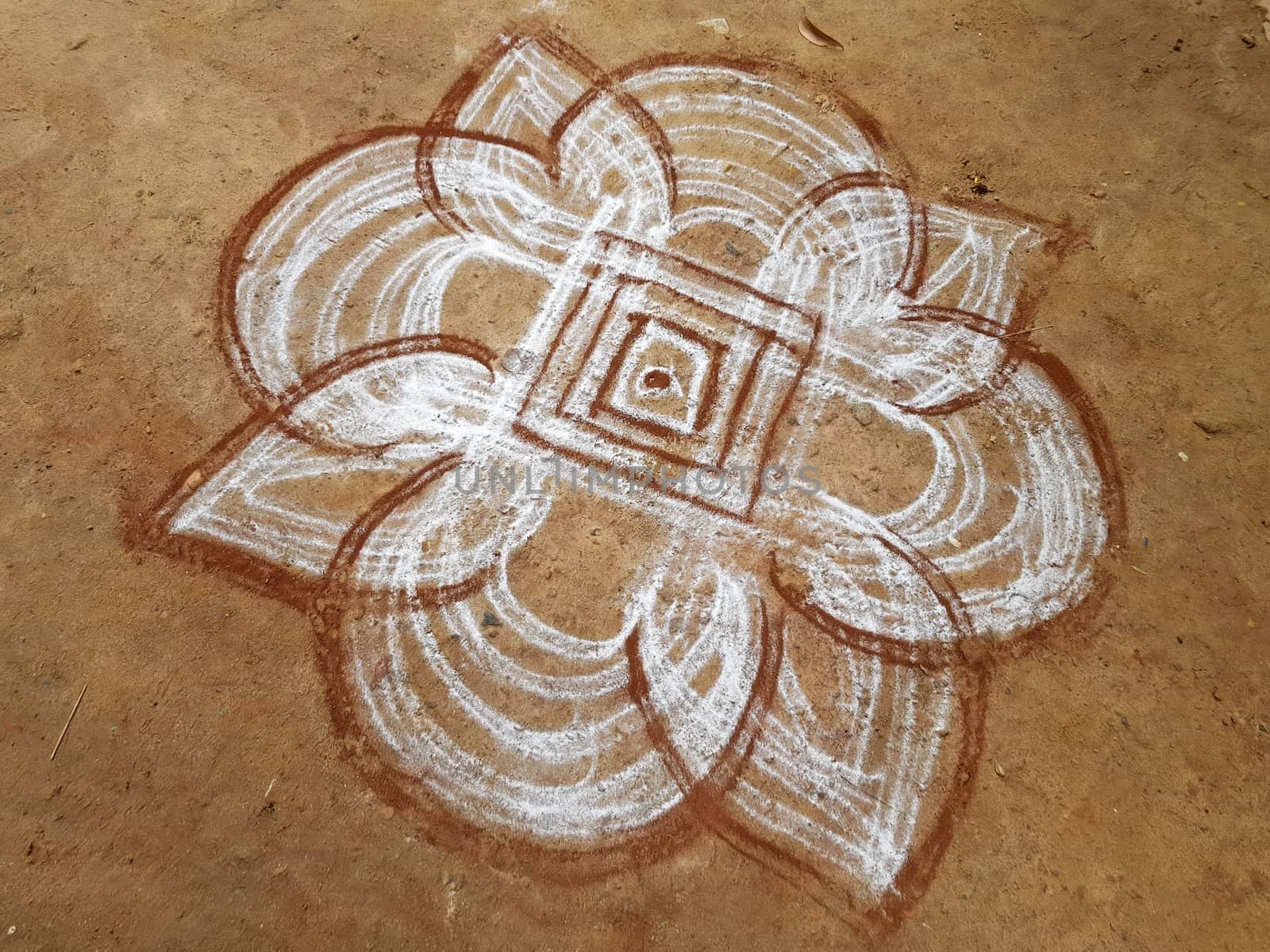 Painting in the sand in the streets from Tiruvanamalai in India Asia