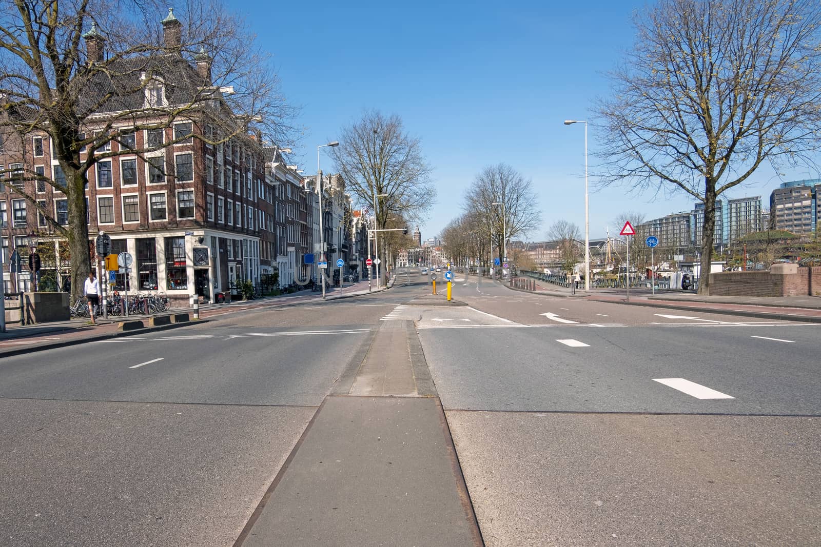 Empty Prins Hendrikkade in the center of Amsterdam during the Corona crisis