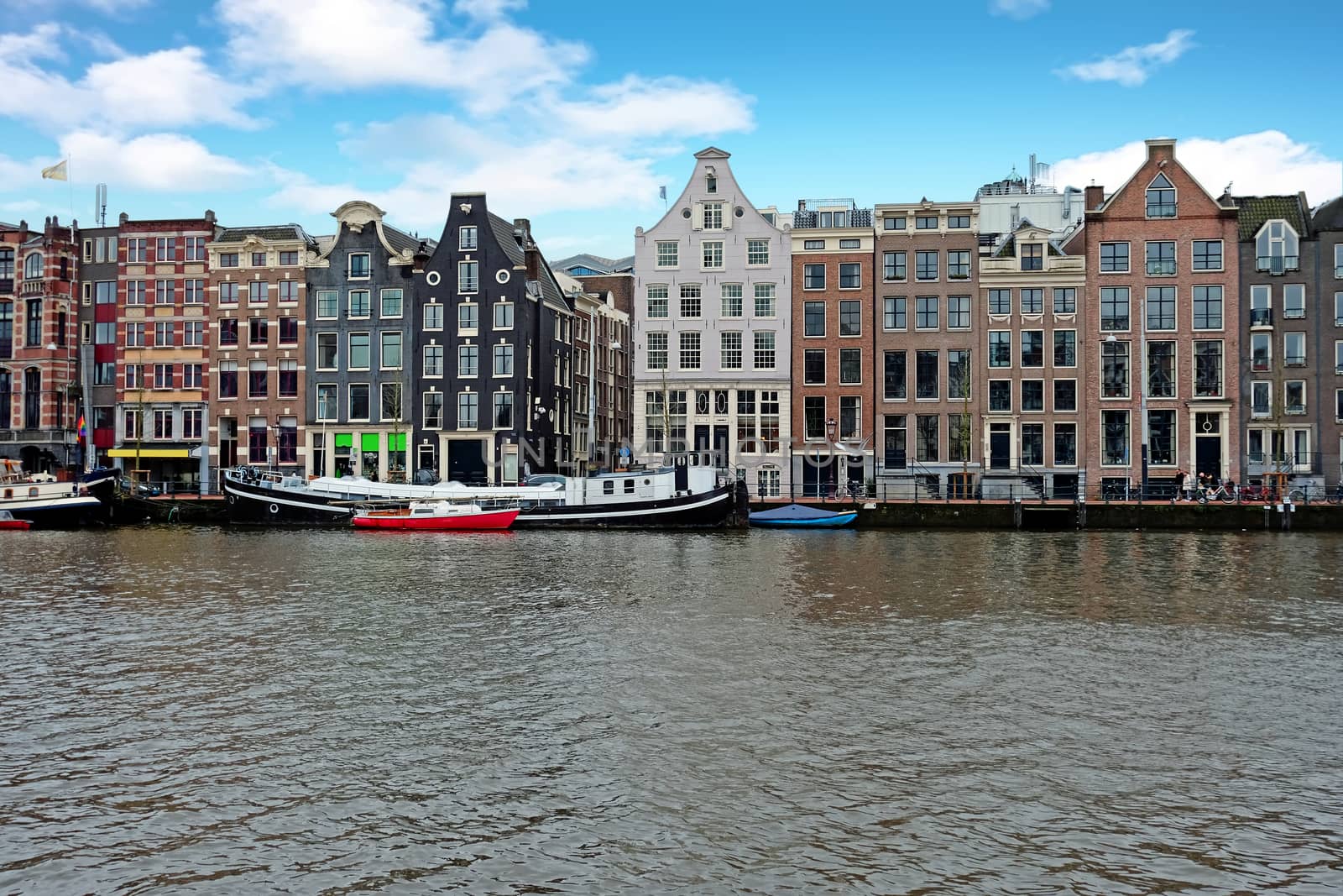 Medieval houses along the river Amstel in Amsterdam Netherlands