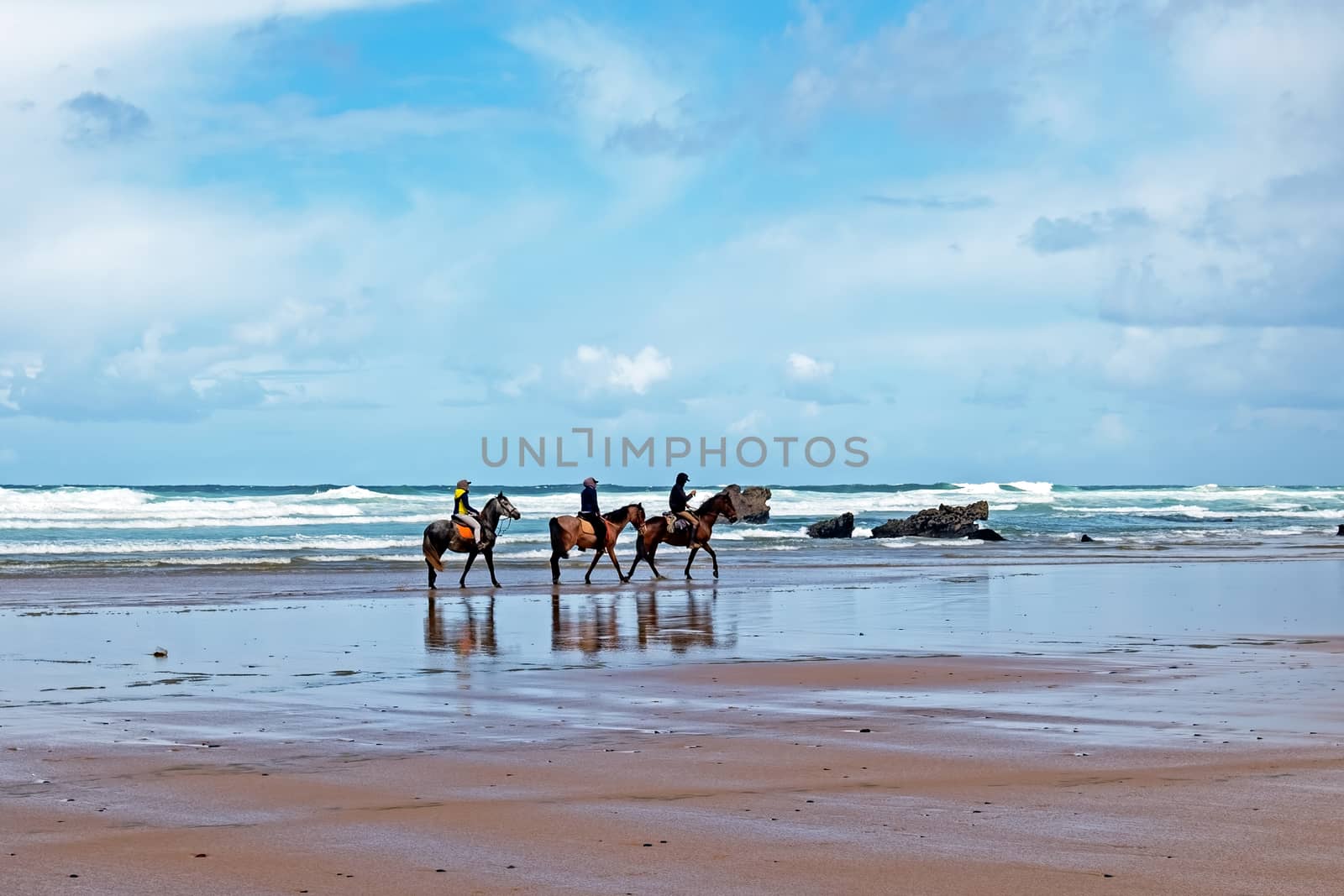 Horse riding at Carapateira beach in the Algarve Portugal