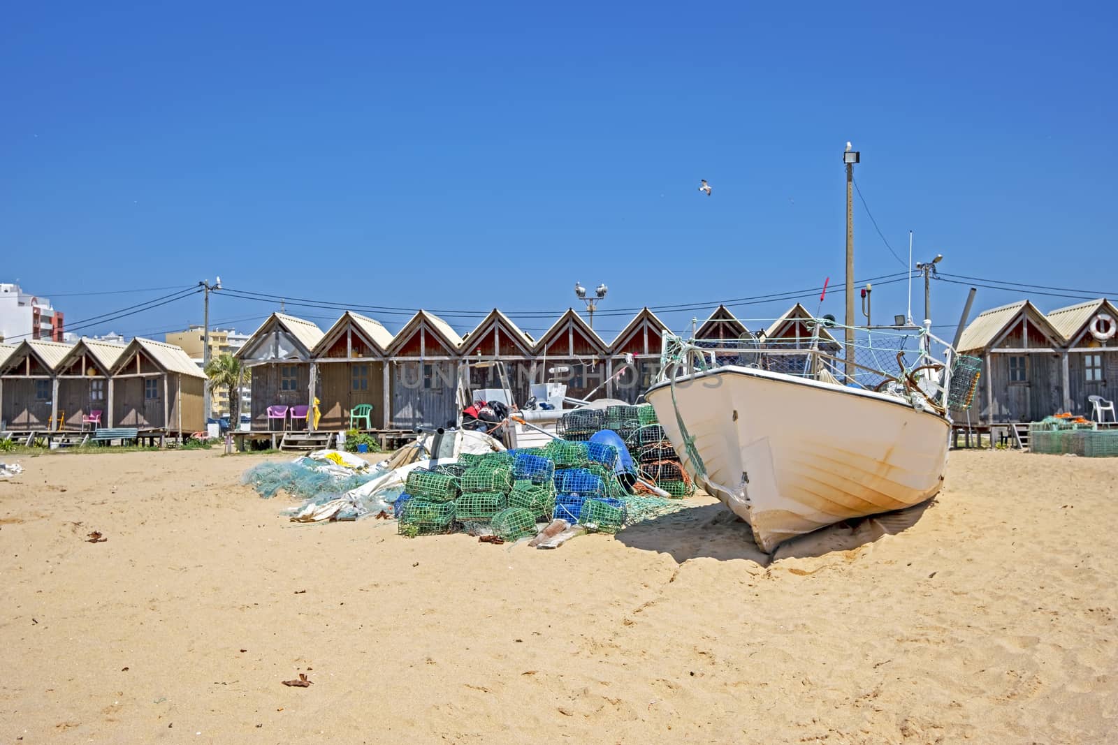 Traditonal fisherman huts on the beach in Armacao de Pera in the Algarve Portugal