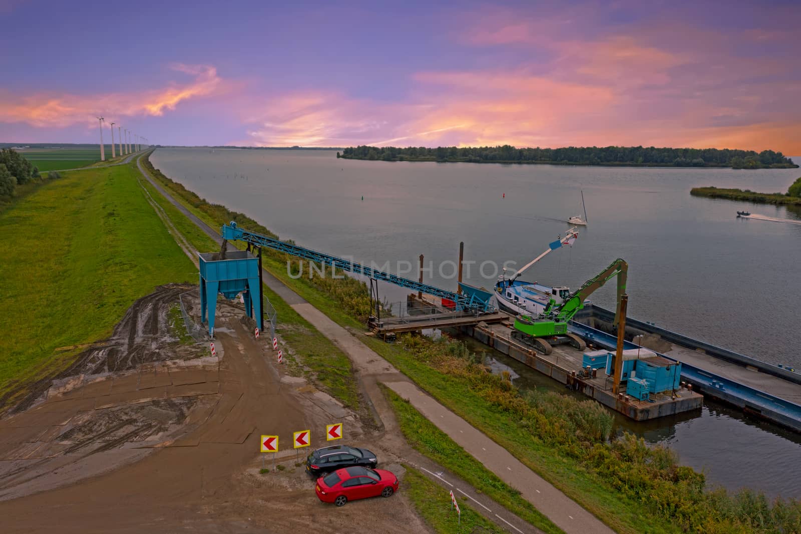 Aerial from freighter unloading sand in the countryside from the Netherlands