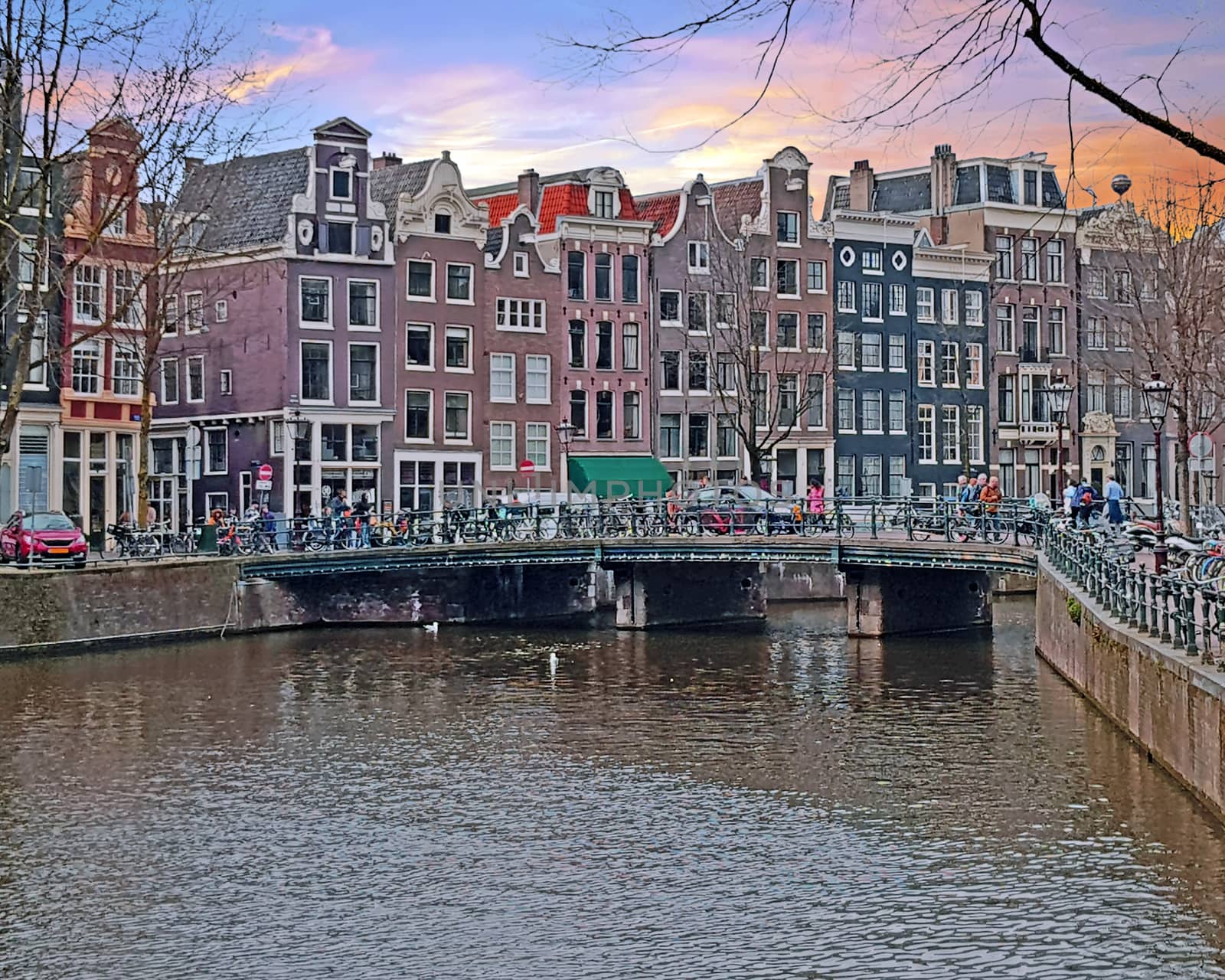 Amsterdam houses along the canal in Amsterdam the Netherlands at sunset
