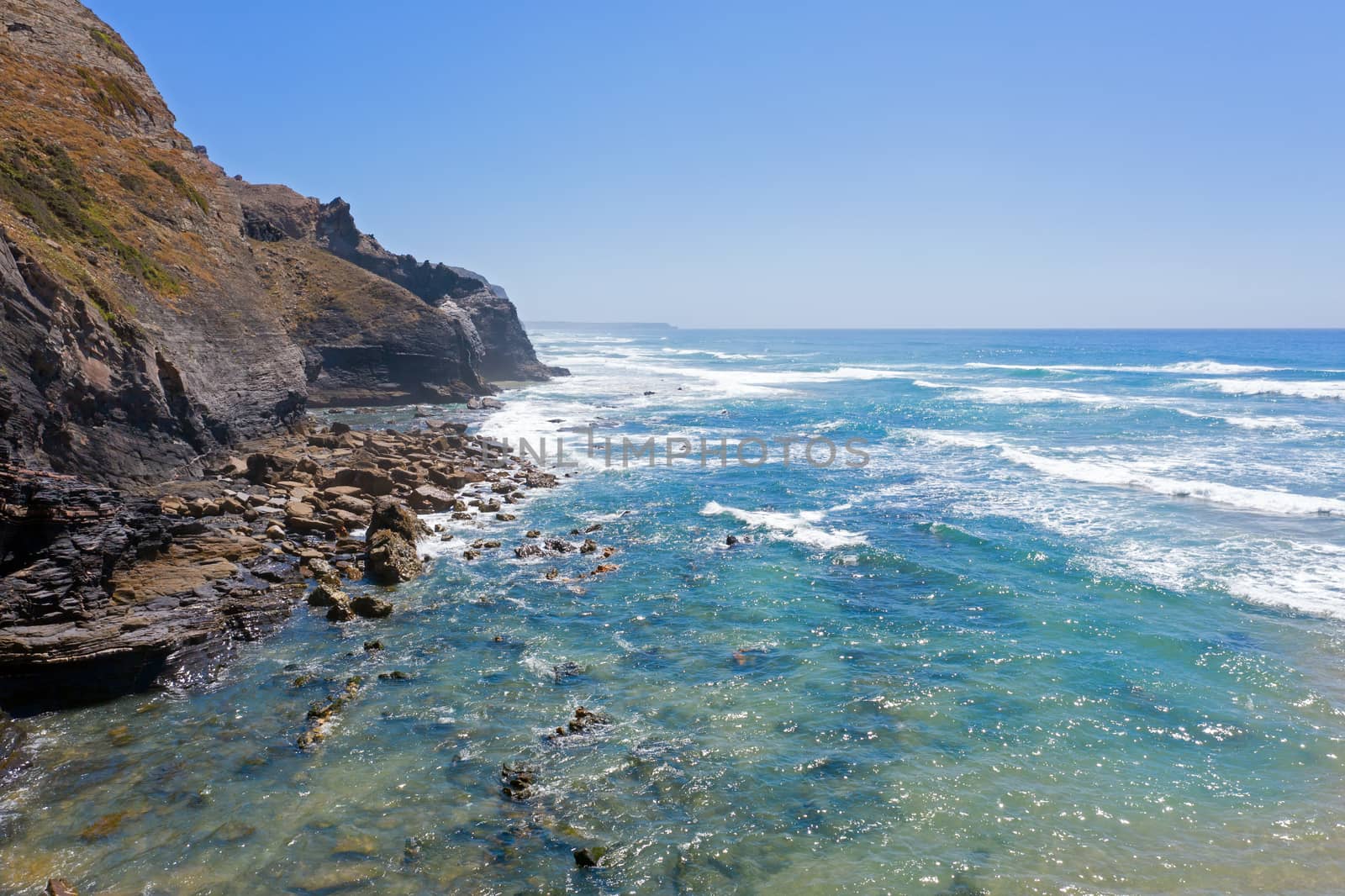 Aerial from natural rocks on Vale Figueiras beach in Portugal
