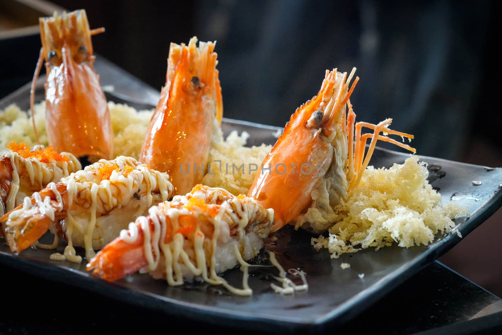 River prawn sushi topped with tobiko mayonnaise. by chadchai_k