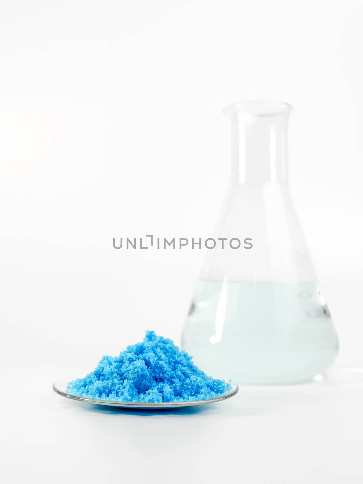 Close up inorganic chemical on white laboratory table. Copper(II) sulfate,  alcohol. Chemical ingredient for Cosmetics & Toiletries product.