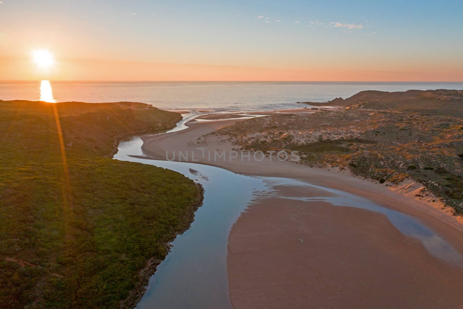 Aerial from Amoreira beach on the westcoast in Portugal at sunset