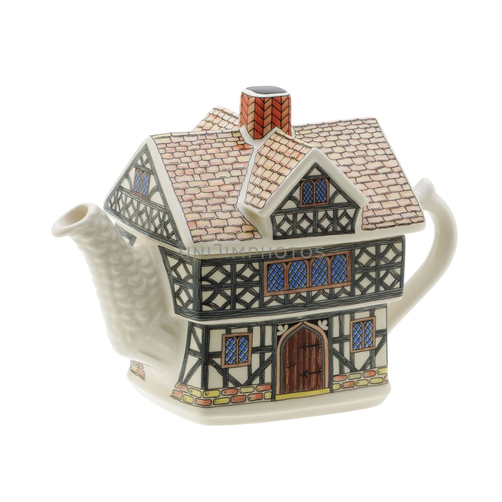 A house shaped teapot on white background with clipping path